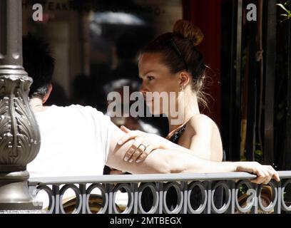 Supermodel and recent 'Dancing with the Stars' castoff, Petra Nemcova chats with friends and her fiance Jamie Belman at a cafe in The Grove shopping center. While seated at their table, Nemcova stroked and looked adoringly at Belman's arm. The two had reportedly been dating for less than a year when they got engaged just before Christmas last year. Los Angeles, CA. 4/26/11. Stock Photo
