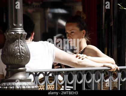 Supermodel and recent 'Dancing with the Stars' castoff, Petra Nemcova chats with friends and her fiance Jamie Belman at a cafe in The Grove shopping center. While seated at their table, Nemcova stroked and looked adoringly at Belman's arm. The two had reportedly been dating for less than a year when they got engaged just before Christmas last year. Los Angeles, CA. 4/26/11. Stock Photo