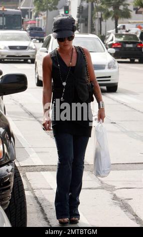 Pop superstar Pink takes a stroll along Melrose Ave. Pink recently performed at the MTV VMA awards on a special outdoor stage and her new single 'So What' is rocketing up the charts. Her new album 'Funhouse' is due in stores on October 28. Los Angeles, CA. 9/12/08. Stock Photo