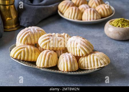 Semolina maamoul or mamoul cookies with dates , walnuts and pistachio nuts. Traditional arabic Eid al Adha, Eid al Fitr sweets Stock Photo