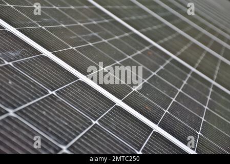 Installation of photovoltaic panels. Macro photography and perspective of the panels and cells. Self-consumption concept. Stock Photo