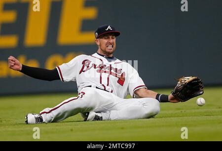 Atlanta Braves left fielder Lane Adams wears a jersey sporting a