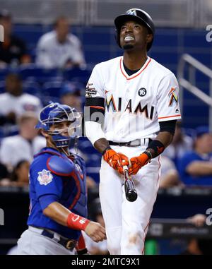 Miami Marlins' Dee Gordon adjusts his gloves during warmups before the  start of a baseball game against the Pittsburgh Pirates, Friday, April 28,  2017 in Miami. (AP Photo/Wilfredo Lee Stock Photo - Alamy