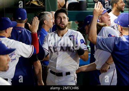 Texas Rangers' Delino DeShields (left), Texas Rangers' Joey Gallo (center)  and Washington Nationals' Bryce Harper (right) socialize prior to a  baseball game against the Texas Rangers, Sunday, June 11, 2017, in  Washington. (