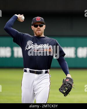 FILE - Atlanta Braves' Freddie Freeman smiles after scoring on a hit by  Marcell Ozuna against the Los Angeles Dodgers during the sixth inning in  Game 4 of a baseball National League