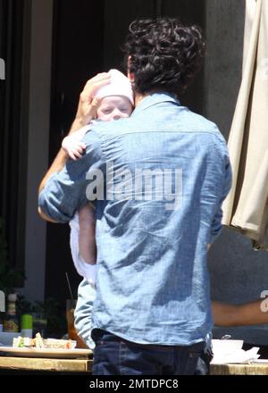 Celebrity stylist Rachel Zoe, husband Rodger Berman and son Skyler spend a family day out, stopping for a bite to eat at an outdoor cafe. West Hollywood, CA. 6/14/11. Stock Photo