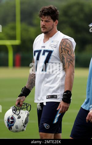 Tennessee Titans tackle Taylor Lewan (77) warms up during training camp at  the NFL football team's practice facility Wednesday, July 27, 2022, in  Nashville, Tenn. (AP Photo/Mark Humphrey Stock Photo - Alamy