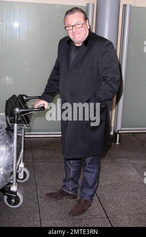 British actor Ray Winstone arrives at Heathrow Airport after a long haul flight from LAX.  Winstone can be seen later this month in another big budget Hollywood film, opposite Mel Gibson in a remake of the BBC’s ’80s nuclear thriller 'Edge of Darkness.'  The role of a CIA agent was originally intended for Robert De Niro.  London, UK. 1/18/10.    . Stock Photo