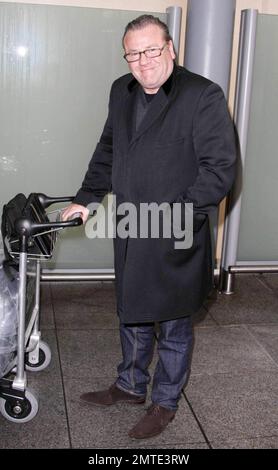 British actor Ray Winstone arrives at Heathrow Airport after a long haul flight from LAX.  Winstone can be seen later this month in another big budget Hollywood film, opposite Mel Gibson in a remake of the BBC’s ’80s nuclear thriller 'Edge of Darkness.'  The role of a CIA agent was originally intended for Robert De Niro.  London, UK. 1/18/10.    . Stock Photo