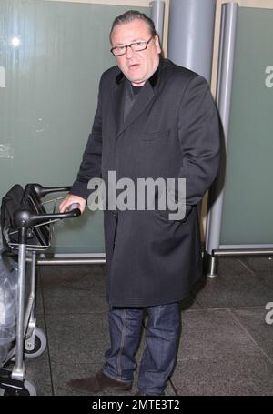 British actor Ray Winstone arrives at Heathrow Airport after a long haul flight from LAX.  Winstone can be seen later this month in another big budget Hollywood film, opposite Mel Gibson in a remake of the BBC’s ’80s nuclear thriller 'Edge of Darkness.'  The role of a CIA agent was originally intended for Robert De Niro.  London, UK. 1/18/10.    . Stock Photo