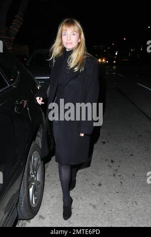 Rebecca De Mornay, dressed all in black, dines at Madeo. De Mornay, best known for her role in the thriller the Hand That Rocks the Cradle, is set to star as another villain in a new movie called Mother's Day. Los Angeles, CA. 12/14/09. Stock Photo