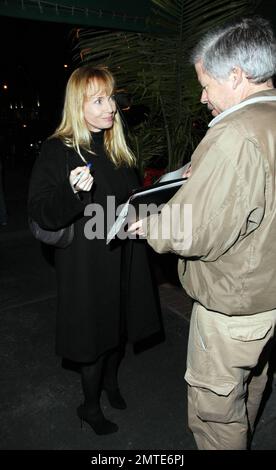 Rebecca De Mornay, dressed all in black, dines at Madeo. De Mornay, best known for her role in the thriller the Hand That Rocks the Cradle, is set to star as another villain in a new movie called Mother's Day. Los Angeles, CA. 12/14/09. Stock Photo