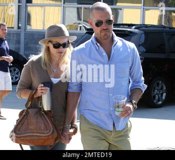 Actress Reese Witherspoon and husband Jim Toth were seen holding hands on their way to Sunday church in Santa Monica.  The couple were married six-month ago at her ranch estate in Ojai. Los Angeles, CA. 18th September 2011.    .