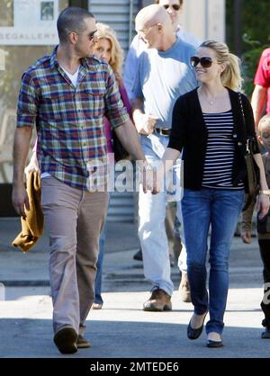 Reese Witherspoon and boyfriend Jim Toth hold hands with her kids, daughter Ava and son Deacon in tow after reportedly attending a Sunday church service.  Reese smiled at Jim as the four, who seem to all get along very well, strolled to a restaurant for lunch before heading home. Los Angeles, CA. 12/12/10. Stock Photo