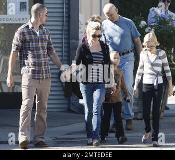 Reese Witherspoon and boyfriend Jim Toth hold hands with her kids, daughter Ava and son Deacon in tow after reportedly attending a Sunday church service.  Reese smiled at Jim as the four, who seem to all get along very well, strolled to a restaurant for lunch before heading home. Los Angeles, CA. 12/12/10. Stock Photo