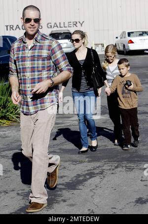 Reese Witherspoon and boyfriend Jim Toth hold hands with her kids, daughter Ava and son Deacon in tow after reportedly attending a Sunday church service.  Reese smiled at Jim as the four, who seem to all get along very well, strolled to a restaurant for lunch before heading home. Los Angeles, CA. 12/12/10. Stock Photo