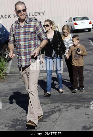 Reese Witherspoon and boyfriend Jim Toth hold hands with her kids, daughter Ava and son Deacon in tow after reportedly attending a Sunday church service.  Reese smiled at Jim as the four, who seem to all get along very well, strolled to a restaurant for lunch before heading home. Los Angeles, CA. 12/12/10. Stock Photo