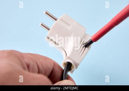 Collapsible design of European electrical plug for self assembly on power cord. Stock Photo