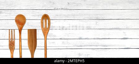 Topview of Set Cooking Wooden Utensils on White Table Background Stock Photo