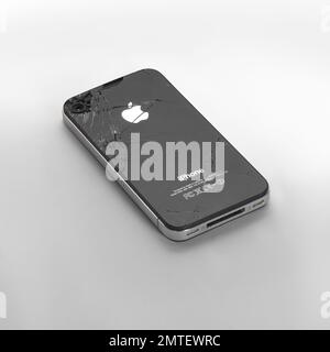 Barcelona- Spain - June 22  2015- Studio shot of backside IPhone 4 from Apple Inc. with logo and marks design. Black color model seriously damaged Stock Photo