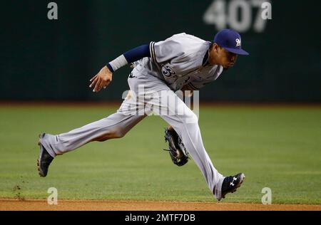 Phoenix, United States. 09th Mar, 2021. Orlando Arcia of the Milwaukee  Brewers tags out Alex Dickerson of the San Francisco Giants during a MLB  spring training game at American Family Fields, Tuesday