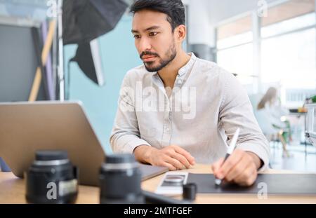 Graphic tablet, laptop and photographer editing photoshoot, focus on digital art or retouching artistic photo. Photography vision, professional design Stock Photo