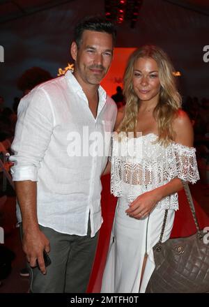 LeAnn Rimes attends Luli Fama fashion show with husband, Eddie Cibrian, during Mercedes-Benz Fashion Week Swim 2015 Collections held in the Cabana Grande at The Raleigh Hotel in Miami Beach, FL. July 20, 2014. Stock Photo