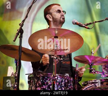 Former Beatle Ringo Starr (Richard Starkey) sings and plays the drums during a live performance with his All-Star Band at Hard Rock Live inside the Seminole Hard Rock Hotel & Casino. Before the show Ringo spoke to the Hard Rock staff and showed off some of his artwork.  After the show Ringo reportedly donated the drum kit he's been using during his All-Star Band tour to The Hard Rock Cafe, combining his charitable efforts with Hard Rock International, which donated $197,500 to Yele Haiti, a Haitian Relief fund. Hollywood, FL. 07/15/10. Stock Photo