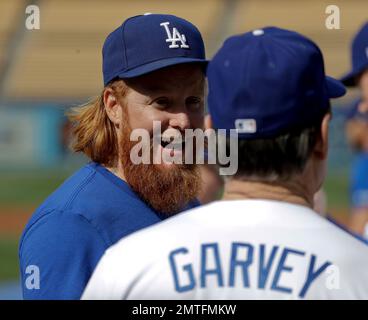 Former Los Angeles Dodger Steve Garvey presents Irvin Magic Johnson with  his Dodger jersey as the new owners of the Los Angeles Dodgers, known as  the Guggenheim Baseball Management Team, hold a