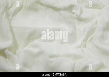 White fabric background. White cloth waves background texture. White fabric cloth textile material. Stock Photo