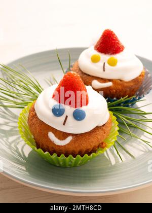 Cupcakes decorated as if they were Christmas elves. Stock Photo