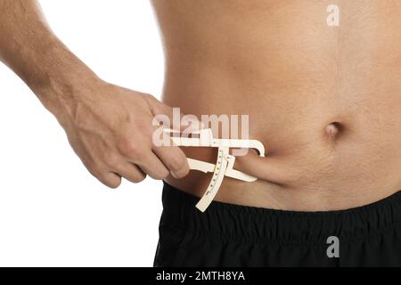 fitness trainer nutritionist measure female body fat percentage with  caliper Stock Photo - Alamy