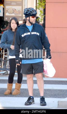 Russell Crowe keeps fit by riding his bike with a personal trainer. Los
