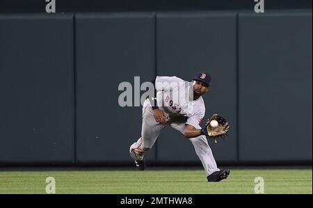 Boston Red Sox's center fielder Jackie Bradley Jr. makes a diving