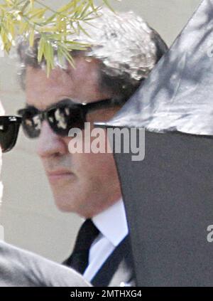 Sylvester Stallone arrives at his son Sage Stallone's funeral. Wearing