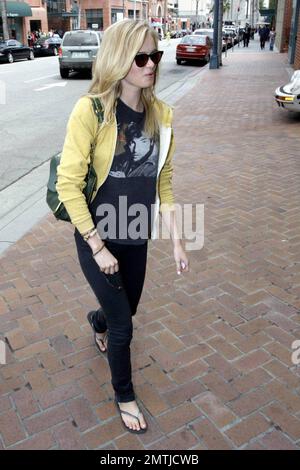 Actress Sarah Paxton smiles for the cameras as she's out and about