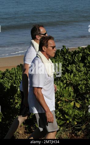 Ex-California Governor Arnold Schwarzenegger makes time for fitness by taking a brisk walk while in Hawaii. 14th September 2011. Stock Photo
