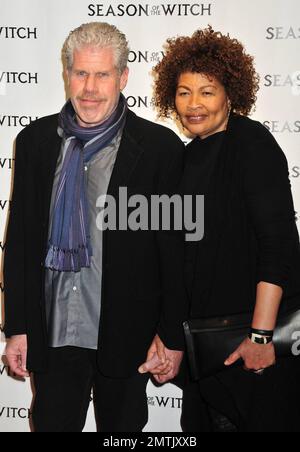 Ron Perlman wife Opal Stone pose for photographers on the red carpet at