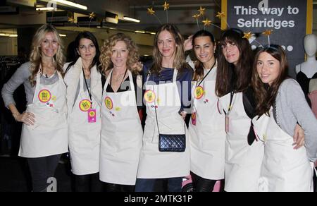 Celebrity stall holders help out at the Selfridges Really Really Great Garage Sale. The event included donations from a range of celebrities including Rachel Weiss,Kate Moss, Jemima Khan and Gwyneth Paltrow with all proceeds go to Mothers4children charity. London, UK. 11/14/10. Stock Photo