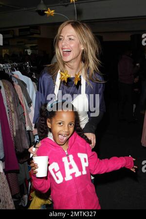 Trinny Woodhall helps out at the Selfridges Really Really Great Garage Sale. The event included donations from a range of celebrities including Rachel Weiss,Kate Moss, Jemima Khan and Gwyneth Paltrow with all proceeds go to Mothers4children charity. London, UK. 11/14/10. Stock Photo