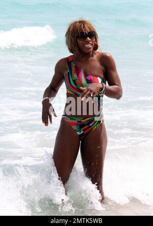 Serena Williams shows off her form in a cutaway bathing suit on the beach. Miami, FL. 3/25/10.   . Stock Photo