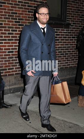 Seth Rogen looks slim and trim as he poses for photos outside the 