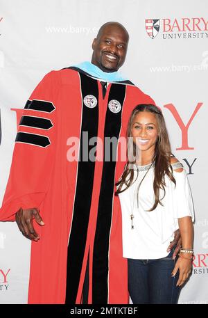 Shaquille O'Neal and his girlfriend Nicole 'Hoopz' Alexander leave a