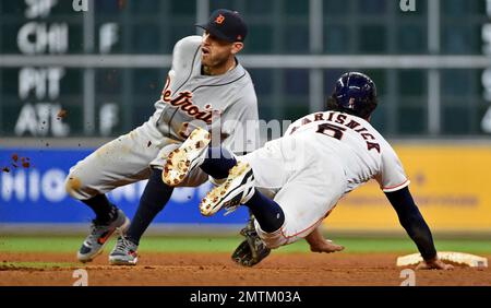 Houston Astros' Jake Marisnick, right, is congratulated in the dugout on  his two-run home run against the Los Angeles Dodgers during the second  inning of a baseball game Friday, Aug. 21, 2015