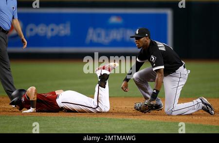 Arizona Diamondbacks' Brandon Drury, left, drips with Gatorade as he  celebrates his game-winning sacrifice fly against the Atlanta Braves with a  bat boy, right, and Jean Segura (2) in the 11th inning