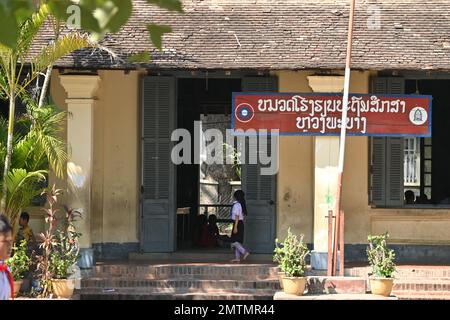 Students playing in the courtyard of a public school in Luang Prabang, Laos Stock Photo