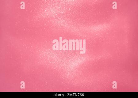 delicate pink background with sequins waves liquid motion Stock Photo