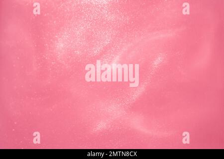 delicate pink background with sequins waves liquid motion Stock Photo