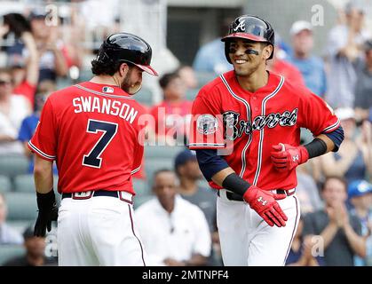 The Braves' Dansby Swanson high fives teammates prior to a game against the  Arizona Diamondbacks on Monday, Aug…