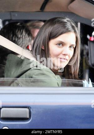 Katie Holmes brings along baby Suri, who seems to be getting bigger every day, as she arrives on the set of her new film 'Son of No One.' Holmes looked to be having a great time on the job as she filmed a scene with Channing Tatum during the shoot in New York, NY. 4/9/10. Stock Photo